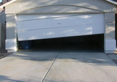 garage door off track repair in in Sunland